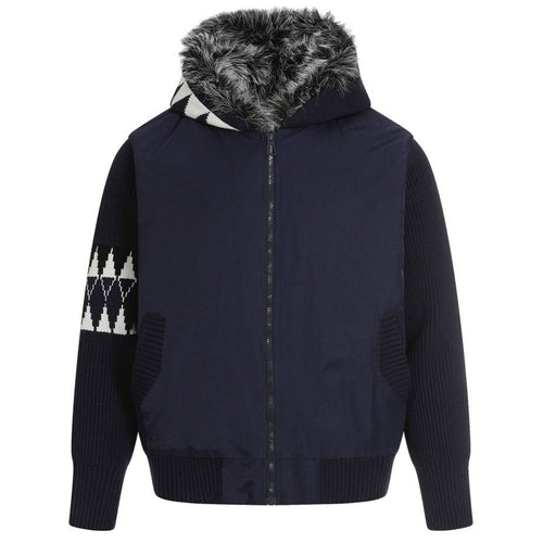 Elevate your luxury outerwear with the House of Teddy Blaze Hybrid Knit Faux Fur Hooded Jacket. Navy blue nylon and ribbed knit hybrid shell, insulated fill, faux fur hood lining, and geometric sleeve graphics. Shop NYC to Vegas style.