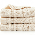 Shop the Iron + Ivy Cable Knit Chunky Throw Blanket by Teddy Blaze. Premium off-white cable knit throw blanket engineered for all-season luxury lounging.