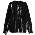 Shop the Iron + Ivy Distressed Contrast Stitch Knit Sweater by Teddy Blaze. Oversized black cotton-blend pullover featuring hand-woven contrast white threads and distressed hole details.