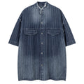 Shop the Iron + Ivy Distressed Denim Stand Collar Short Sleeve Shirt by Teddy Blaze. Oversized indigo short-sleeve denim shirt featuring raw frayed collars, self-striping, and metal snap hardware.