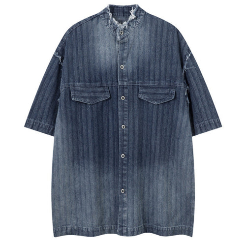 Shop the Iron + Ivy Distressed Denim Stand Collar Short Sleeve Shirt by Teddy Blaze. Oversized indigo short-sleeve denim shirt featuring raw frayed collars, self-striping, and metal snap hardware.