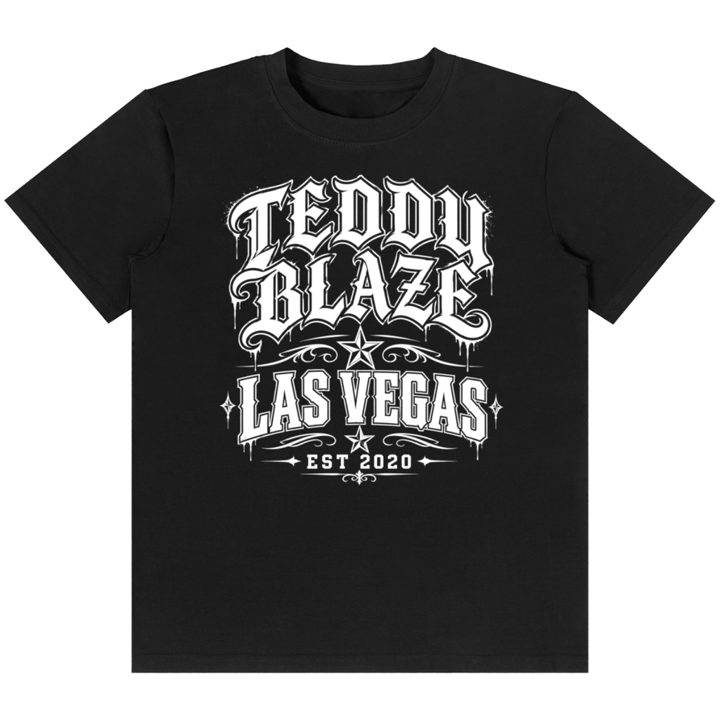 Shop the Las Vegas Tattoo Tee by Teddy Blaze. 180 GSM cotton-spandex stretch tee featuring Chicano tattoo script typography from the TOPS line of The Mature Mocha Collection.