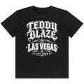 Shop the Las Vegas Tattoo Tee by Teddy Blaze. 180 GSM cotton-spandex stretch tee featuring Chicano tattoo script typography from the TOPS line of The Mature Mocha Collection.