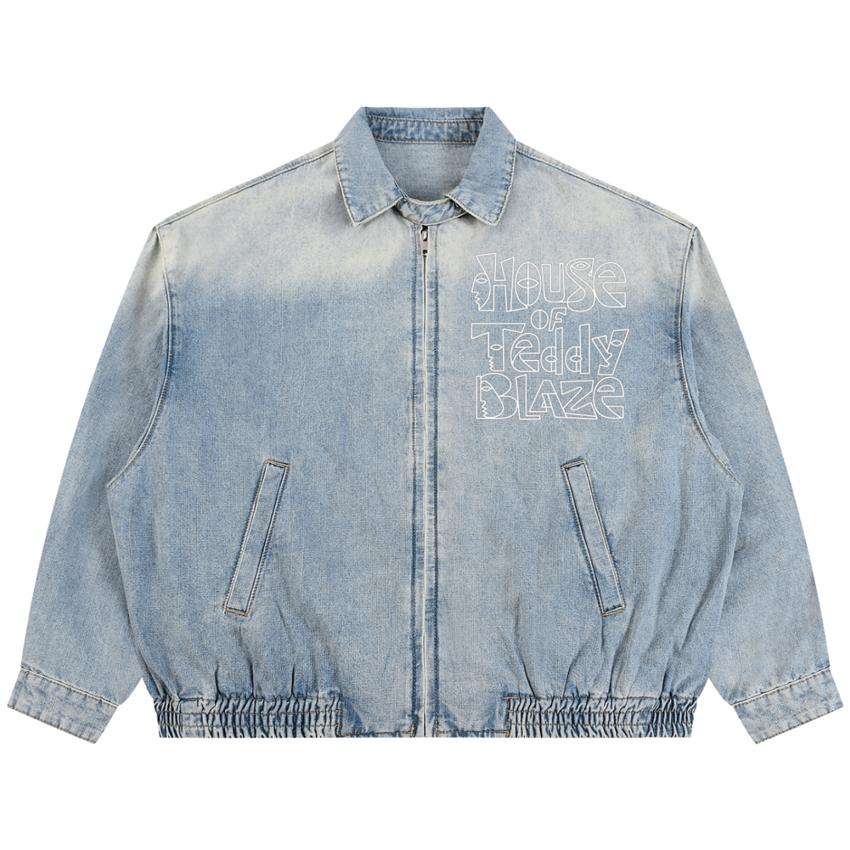 A light blue washed denim jacket with a front zipper, elasticated hem and cuffs, and 'House of Teddy Blaze' embroidered in white on the left chest, shown flat on a white background.