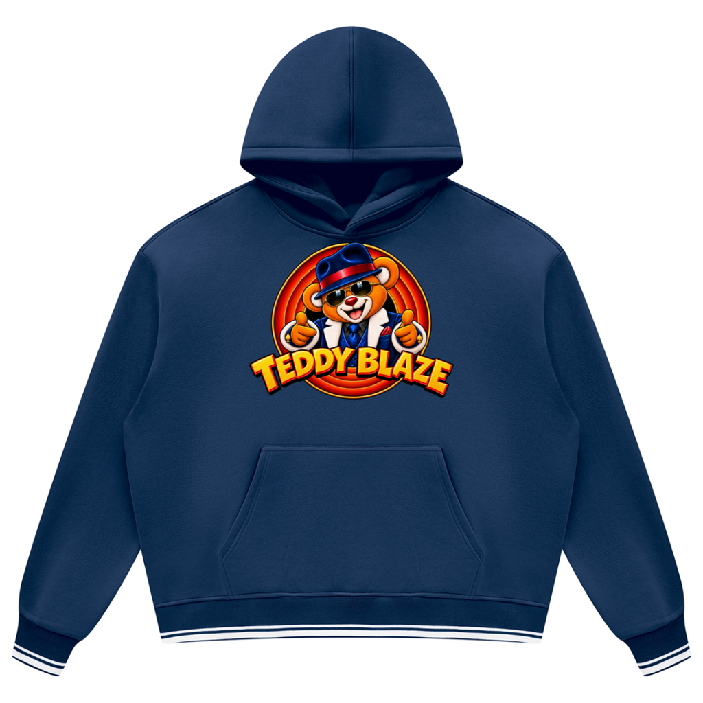 Elevate your preppy streetwear layers with the House of Teddy Blaze Mr Blaze Striped Trim Fleece Hoodie. Navy blue 345 gsm fleece, striped ribbed trim, kangaroo pocket, and suit-and-fedora bear graphics. Shop NYC to Vegas style.