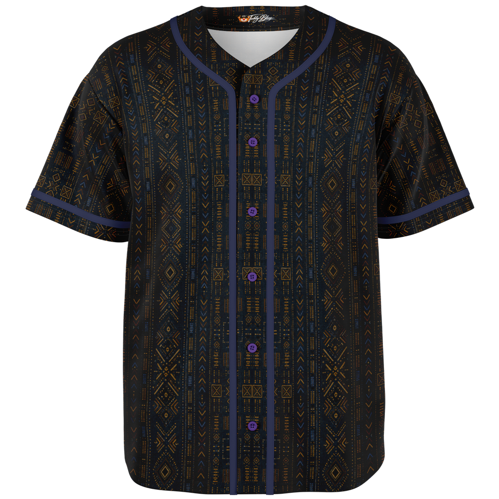 Shop the Teddy Blaze Mud Adire Baseball Jersey, blending indigo African textile-inspired geometry with classic American sportswear and contrast piping.