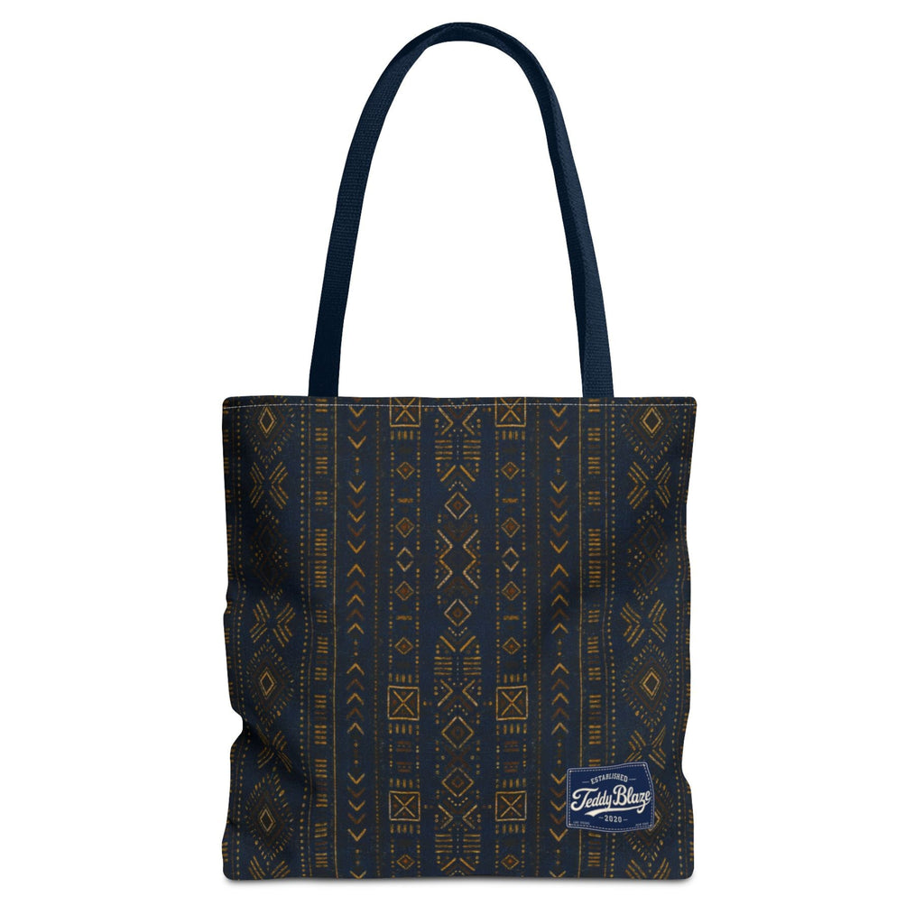 Carry more in the Teddy Blaze Mud of Indigo Grab + Go Bag, an 18" oversized tote featuring indigo mudcloth-inspired artwork, boxed corners and reinforced handles.