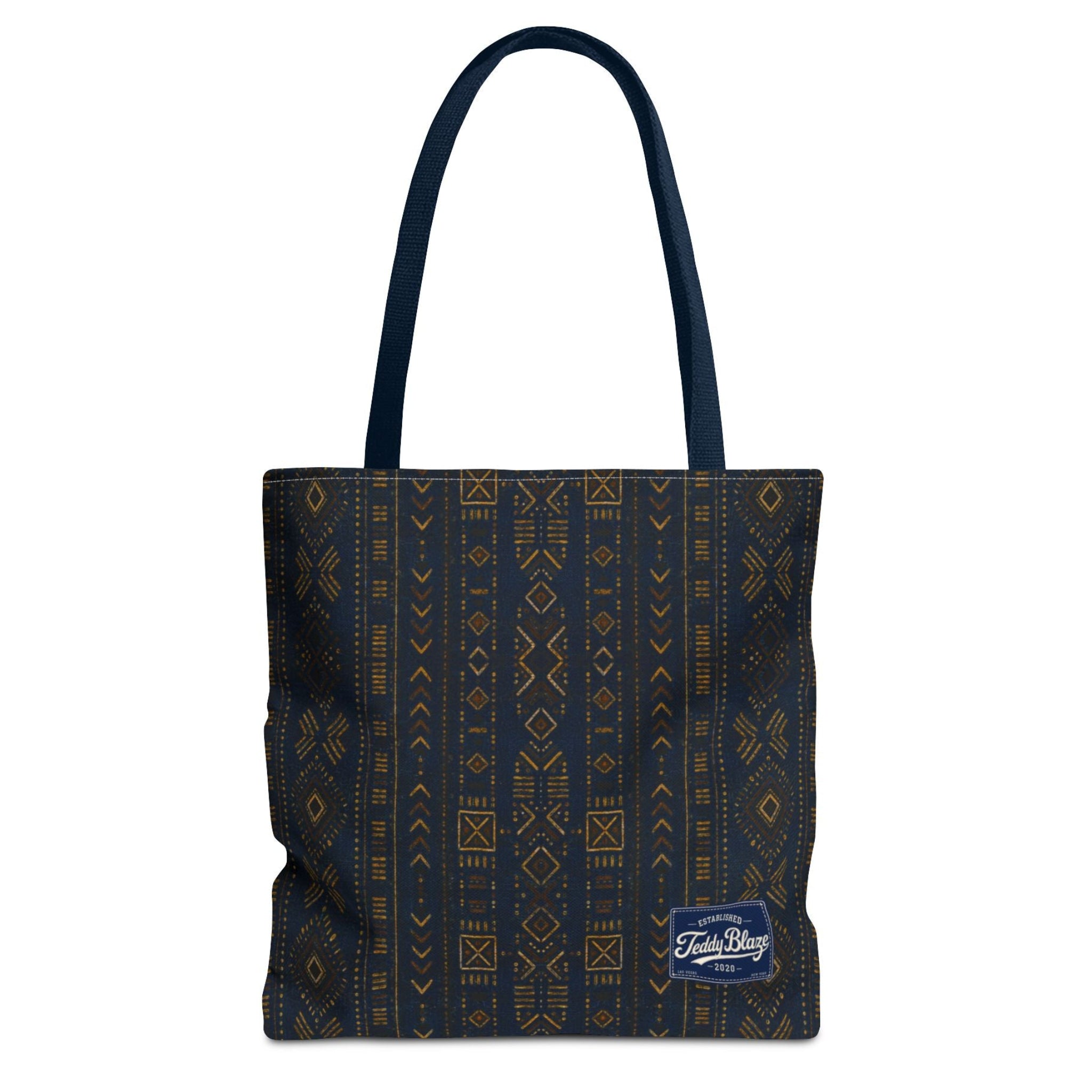 Carry more in the Teddy Blaze Mud of Indigo Grab + Go Bag, an 18" oversized tote featuring indigo mudcloth-inspired artwork, boxed corners and reinforced handles.