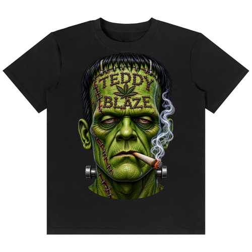Shop the Munchinstein's Monster Classic Tee by Teddy Blaze. 180 GSM cotton-spandex stretch tee featuring a Frankenstein graphic from the TOPS line of The Mature Mocha Collection.