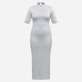 An elegant white midi dress featuring tonal Sankofa and Gye Nyame lace artwork, a mock neckline and sculpted silhouette from Teddy Blaze.