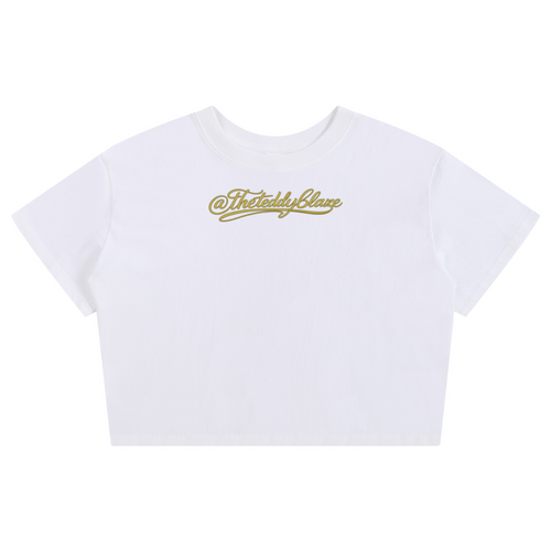 Shop the Signature Baby Tee by Teddy Blaze. 100% premium cotton white cropped tee with gold script branding from THE BLAZE WOMAN.