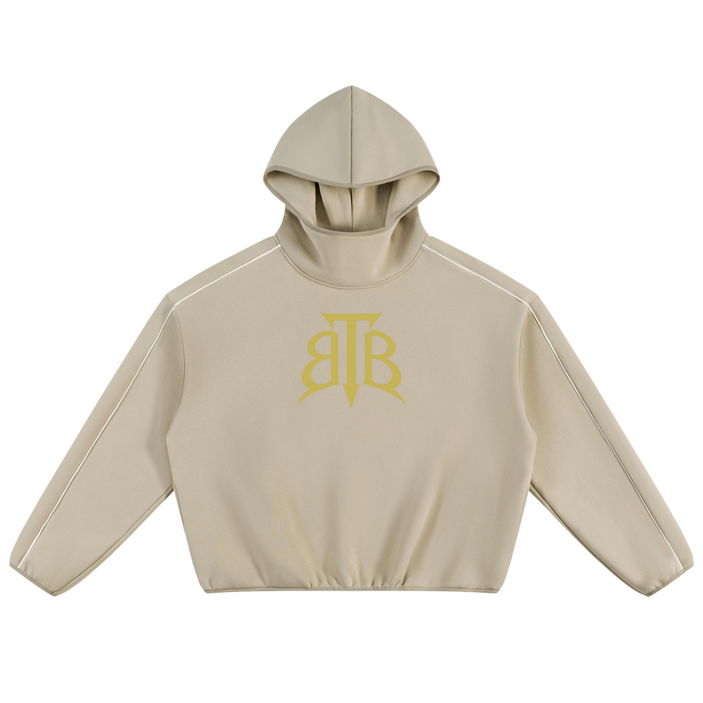 Shop the Signature Cachet Boxy Piping Detail Fleece Hooded Jumper by Teddy Blaze. 350 GSM sand fleece hoodie featuring piping details and Cachet emblem from The Mature Mocha Collection.