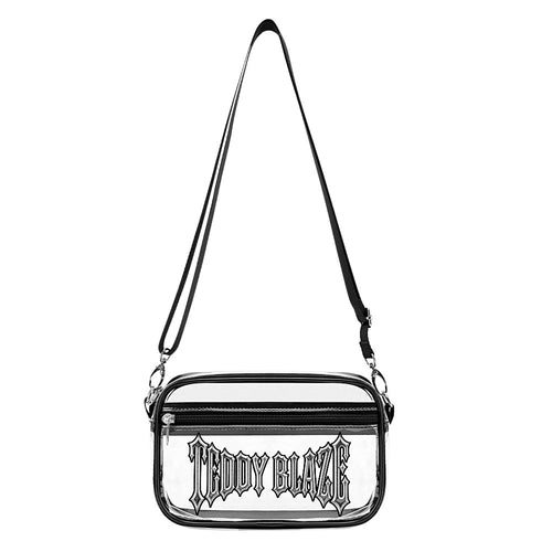 A transparent PVC crossbody bag with black trim, front zip pocket and signature Teddy Blaze wordmark—ready for clear-bag-policy days.