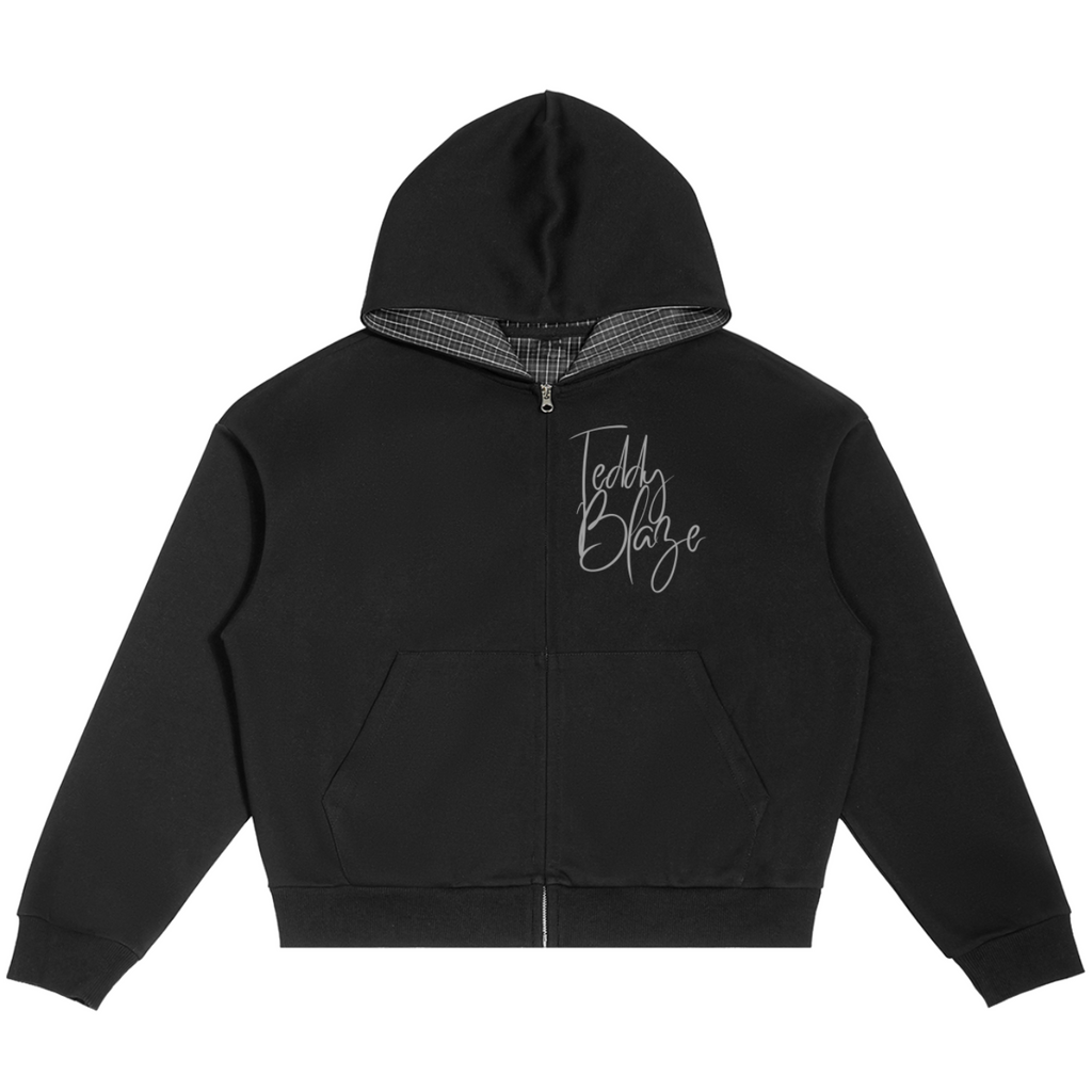 Elevate your casual outerwear with the House of Teddy Blaze Signature Plaid Detail Box Cut Zip Hoodie. Black 350 gsm fleece, plaid-lined hood, full zip front, and script logo chest graphic. Shop NYC to Vegas style.