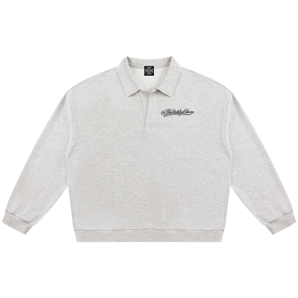 Shop the Signature Rugby Shirt by Teddy Blaze. Heavyweight 310 GSM heather gray fleece rugby pullover with black script branding from THE BLAZE MAN.