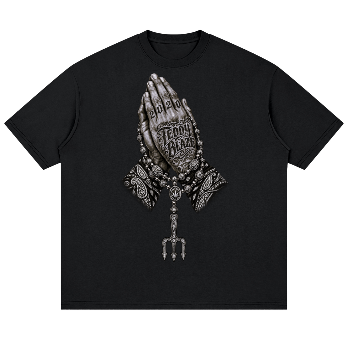 Elevate your streetwear with the Teddy Blaze Sin City Drop Shoulder Cotton Tee. Black cotton, tattoo praying hands print, and Sin City back graphic. Shop NYC to Vegas style.