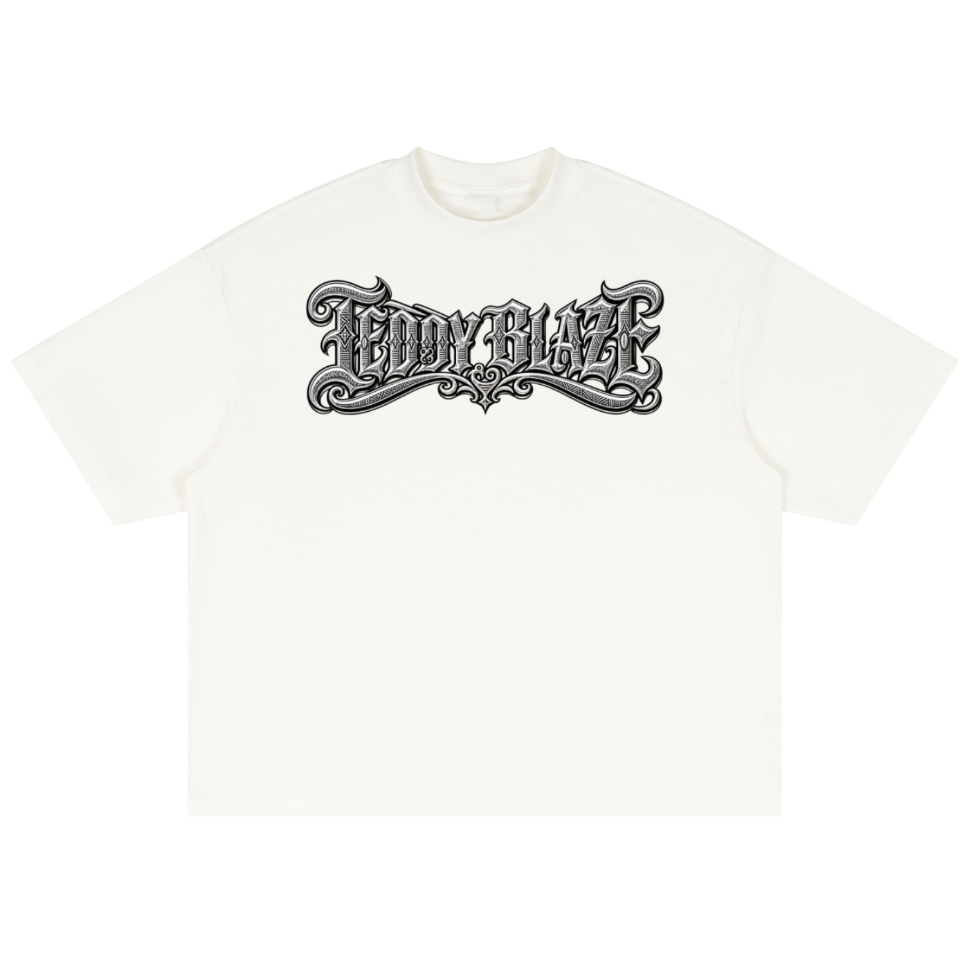 A boxy waffle knit tee in a cotton blend with the new Teddy Blaze signature graphic. Textured streetwear from MEN OF BLAZE.