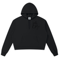 Elevate your casual outerwear with the House of Teddy Blaze Signature V-Neck Box Cut Raw Edge Hoodie. Black 360 gsm fleece, notched V-neck hood collar, raw edge details, and tonal script logo. Shop NYC to Vegas style.