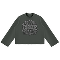 Elevate your cold-weather wardrobe with the Teddy Blaze Sin City Mock Neck Raw Edge Box Cut Jumper. Olive green heavy fleece, mock neck, raw hem, and tattoo praying hands print. Shop NYC to Vegas style.