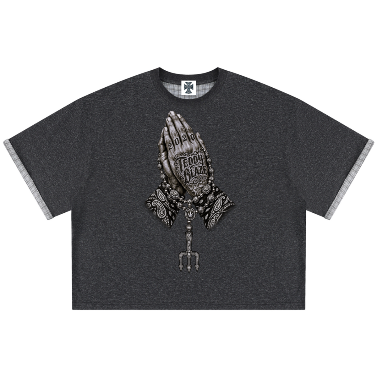 Elevate your casualwear with the Teddy Blaze Sin City Sacred Plaid-Lined Double-Face Tee. Charcoal stretch-cotton, exposed plaid trim, and tattoo praying hands print. Shop NYC to Vegas style.