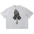 Elevate your streetwear with the Teddy Blaze Sin City Sacred Box Cut T-Shirt. Heather gray cotton blend, tattoo praying hands print, and boxy cut. Shop NYC to Vegas style.