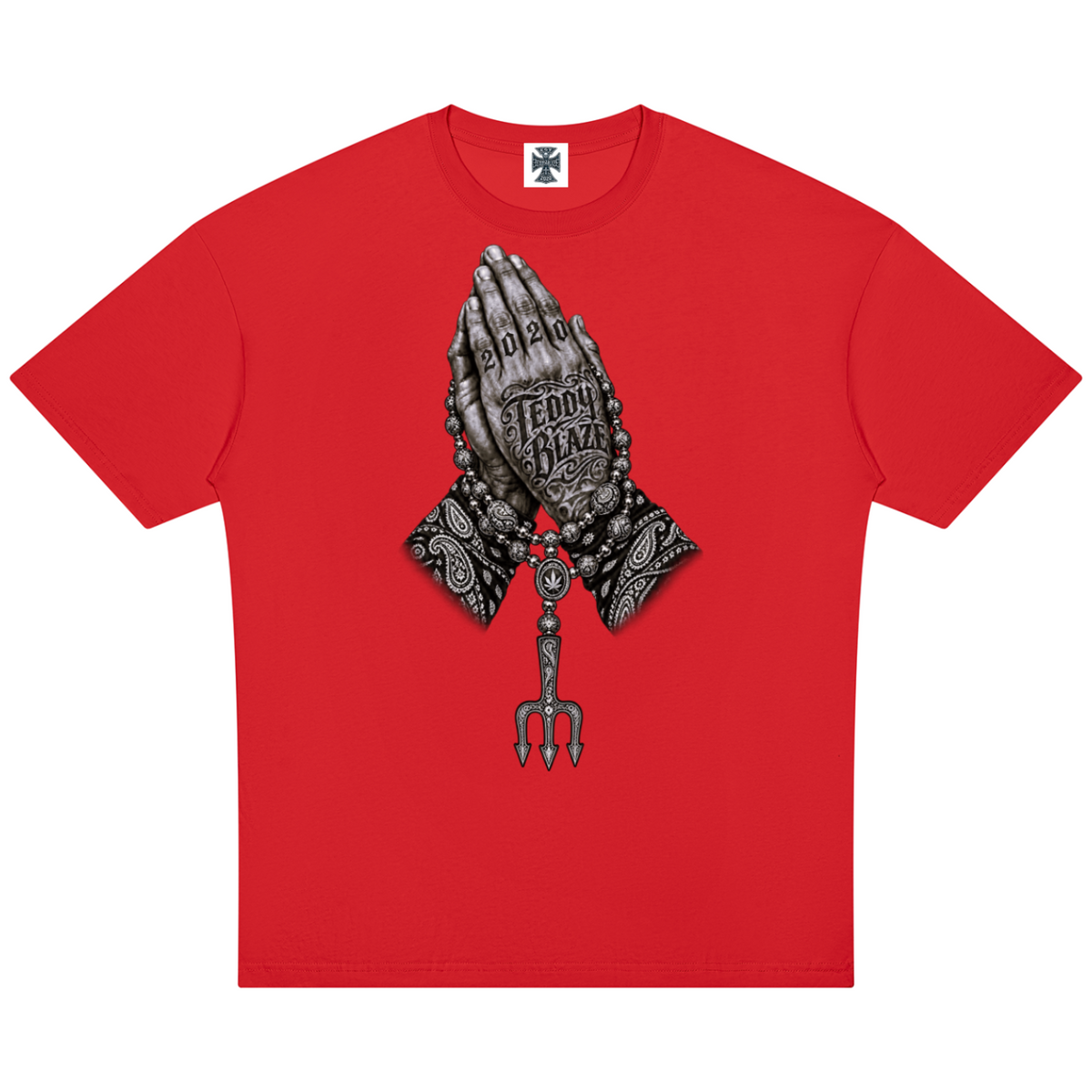 Elevate your streetwear with the Teddy Blaze Sin City Sacred Cotton Drop Shoulder Tee. Red cotton, tattoo praying hands print, and ornate back graphic. Shop NYC to Vegas style.