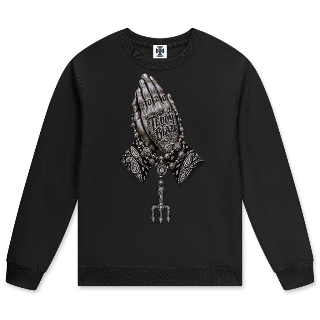 Elevate your cool-weather layers with the Teddy Blaze Sin City Sacred Cotton Jumper. Black cotton crewneck sweatshirt with tattoo praying hands and Sin City back print. Shop NYC to Vegas style.