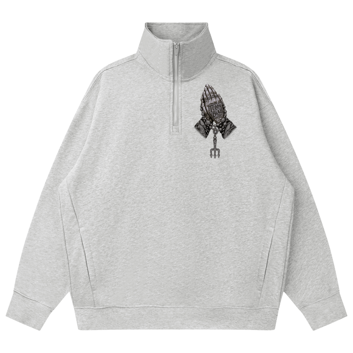 A light gray heathered quarter-zip sweatshirt with a black graphic of a praying hand holding a pitchfork on the left chest, displayed on a solid white background.