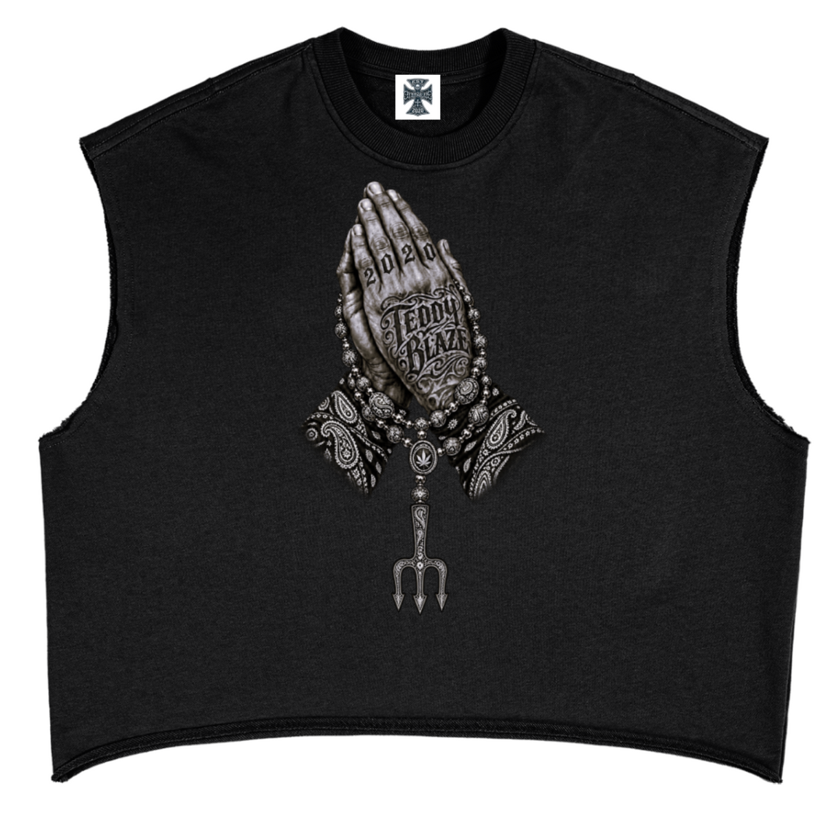 Elevate your sleeveless style with the Teddy Blaze Sin City Sacred French Terry Box Cut Tank. Black heavy French terry, frayed armholes, and tattoo praying hands print. Shop NYC to Vegas style.
