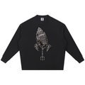 Elevate your knitwear with the Teddy Blaze Sin City Sacred Ribbed Knit Jumper. Black ribbed cotton-poly knit, praying hands chest graphic, and ornate Sin City back print. Shop NYC to Vegas style