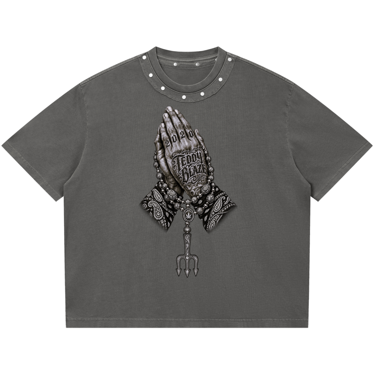 Elevate your boxy graphic tees with the Teddy Blaze Sin City Sacred Snow Wash Studded Cotton Tee. Charcoal snow-washed cotton, metal studded collar, and tattoo praying hands print. Shop NYC to Vegas style.