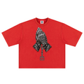 Elevate your streetwear with the Teddy Blaze Sin City Sacred Snow Wash Boxy Cotton Tee. Red snow-washed heavy cotton, tattoo praying hands print, and boxy cut. Shop NYC to Vegas style.
