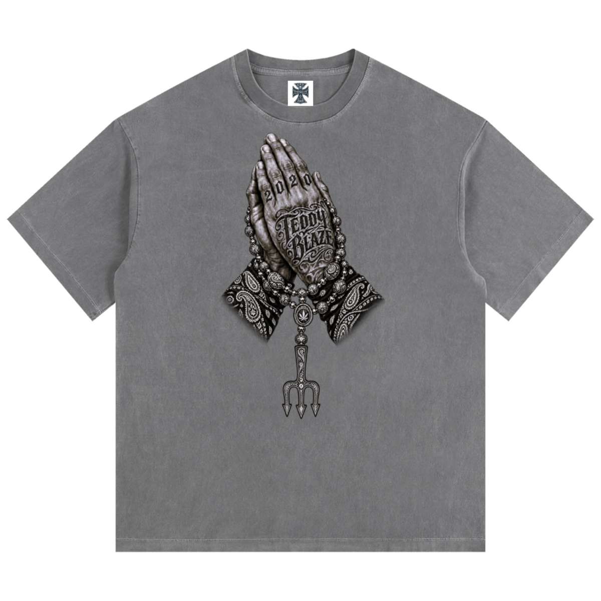 Elevate your casualwear with the Teddy Blaze Sin City Sacred Vintage Washed Cotton Tee. Charcoal gray heavy cotton, vintage wash, tattoo praying hands print, and ornate back graphic. Shop NYC to Vegas style.