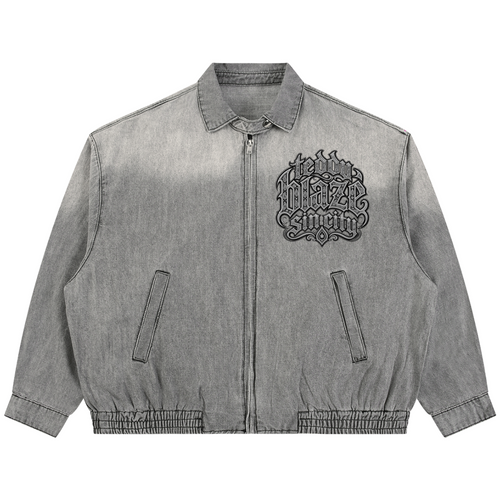 Elevate your transitional outerwear with the Teddy Blaze Sin City Vintage Wash Denim Jacket. Sun-washed gray denim, zip front, elastic hem, and filigree house back graphic. Shop NYC to Vegas style.