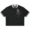 Elevate your sporty layers with the Teddy Blaze Sin City Sacred Baseball Jersey. Black stretch-cotton button-up jersey, contrast ribbed trim, and tattoo praying hands graphic. Shop NYC to Vegas style.