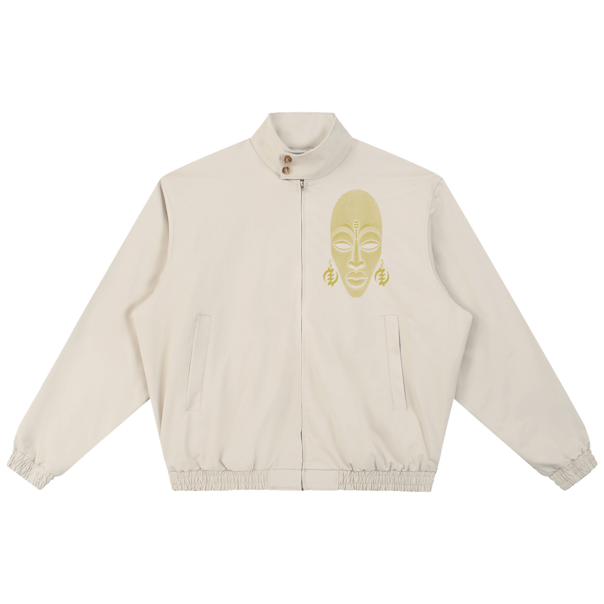 An off-white zip-up jacket featuring a gold embroidered African mask face on the left chest, displayed against a solid white background.