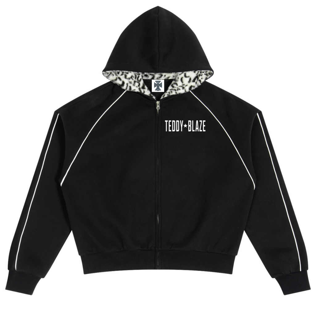 Elevate your statement outerwear with the House of Teddy Blaze Statement Piping + Leopard Detail Fleece Zip Hoodie. Crimson red 305 gsm fleece, contrast white piping, leopard faux fur hood lining, and bold star block typography. Shop NYC to Vegas style.