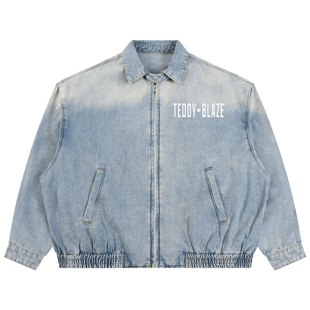 Elevate your casual outerwear with the House of Teddy Blaze Statement Vintage Wash Denim Jacket. Light wash 320 gsm cotton denim, zip front, elastic hem, and bold star block typography. Shop NYC to Vegas style.
