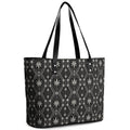 A structured cross-grain leather handbag featuring the DaChek house pattern, black straps and a roomy tote silhouette from Teddy Blaze.