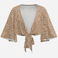 Earth-tone Teddy Blaze cropped wrap cover-up featuring trompe l'oeil lace, Sankofa motifs, flowing bat-wing sleeves and an adjustable tie front.