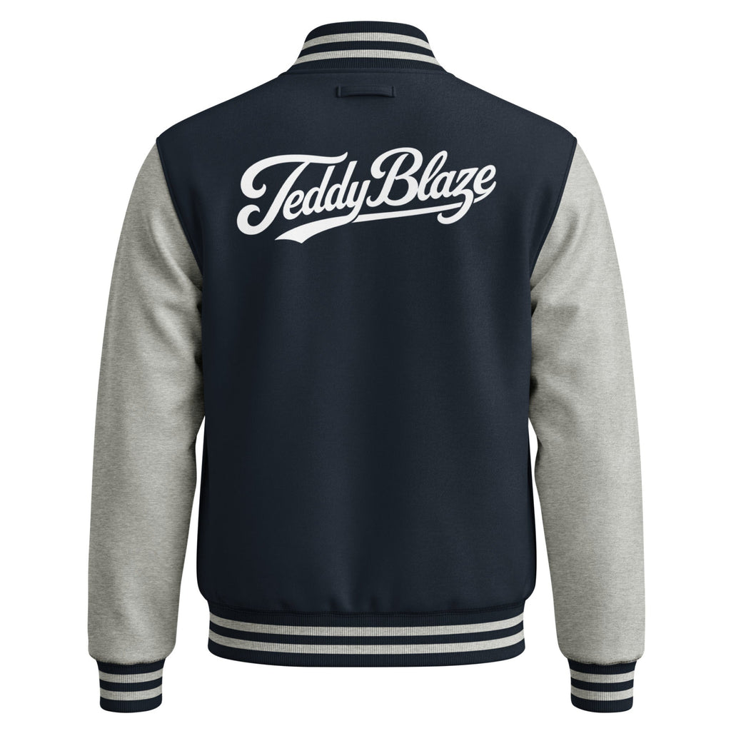 Shop the Men's Signature Varsity Jacket by Teddy Blaze. Medium-heavy fleece jacket with contrast sleeves, snap closure, and script Teddy Blaze back graphic.