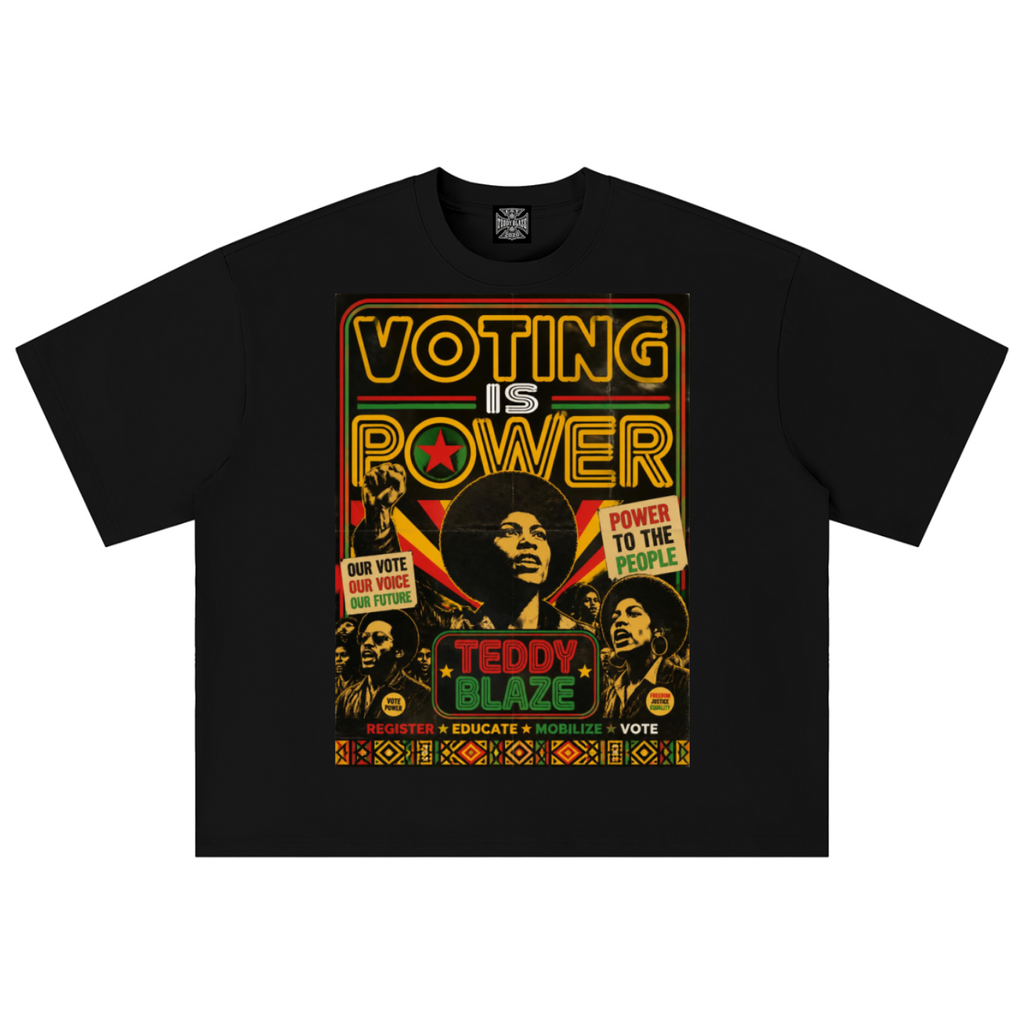 A black short-sleeve t-shirt with a large, colorful graphic print on the front. The graphic features the text 'VOTING IS POWER' in a yellow and red neon-style font, surrounded by images of civil rights figures and slogans including 'POWER TO THE PEOPLE' and 'TEDDY BLAZE'.