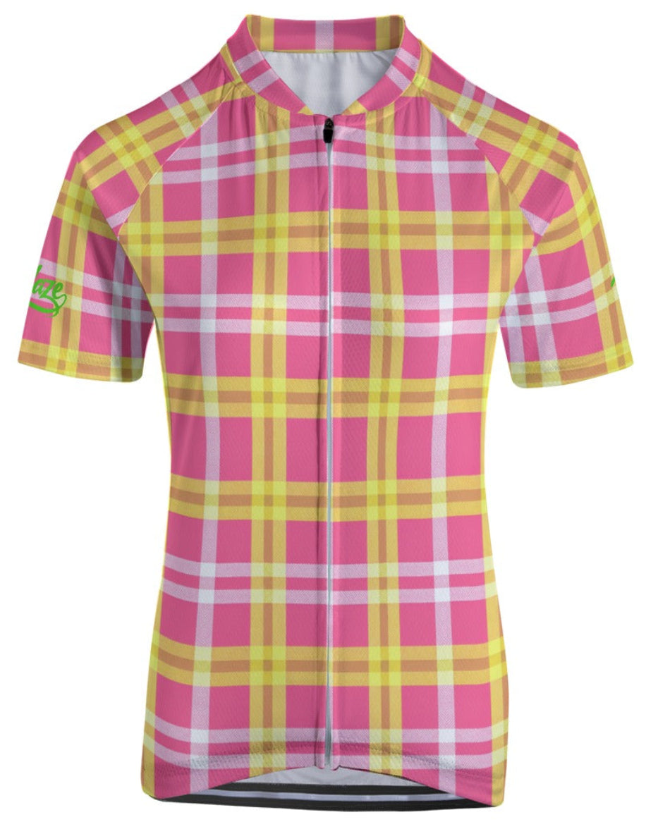 Shop the Iron + Ivy Women’s Heritage Plaid Performance Cycling Jersey by Teddy Blaze. Women's slim-fit short sleeve cycling jersey featuring pink, yellow, and white plaid with neon sleeve script.